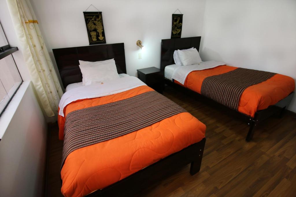 Postel nebo postele na pokoji v ubytování Hotel Peru Real