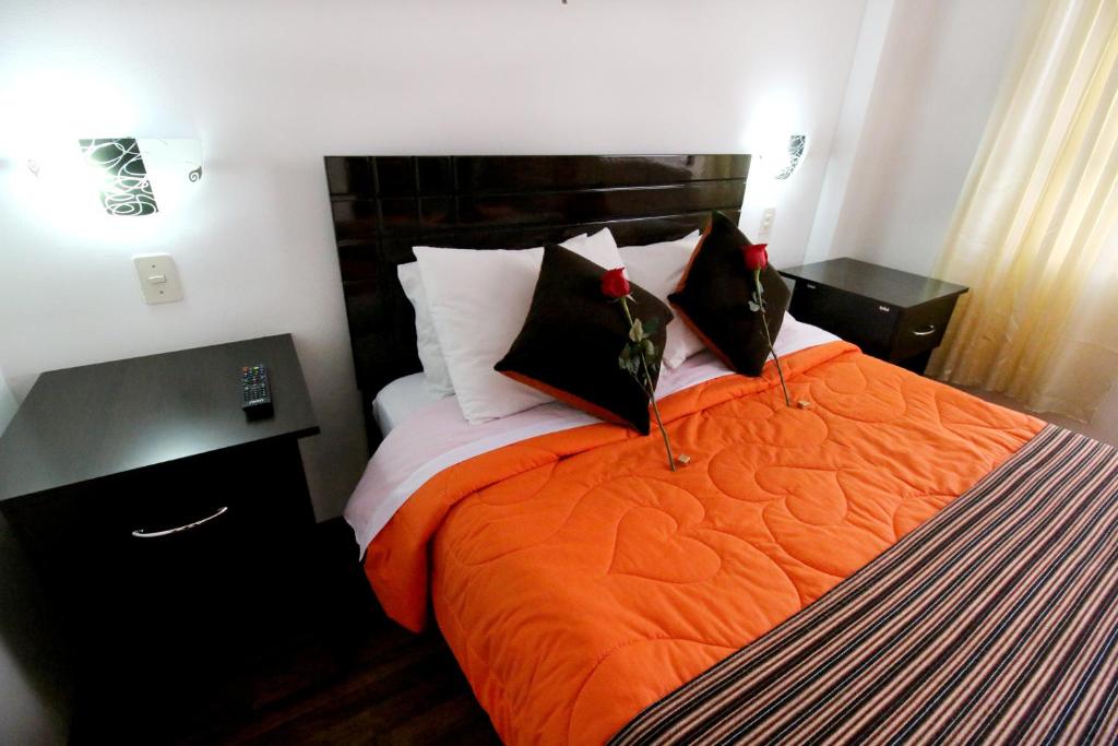 Postel nebo postele na pokoji v ubytování Hotel Peru Real