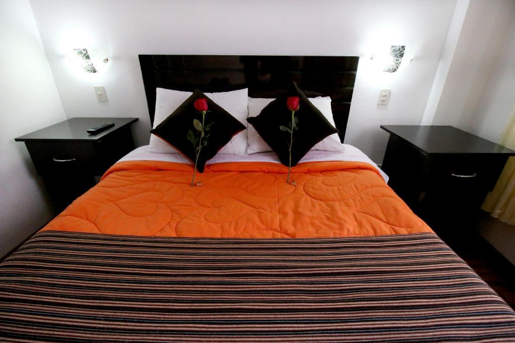 Postel nebo postele na pokoji v ubytování Hotel Peru Real