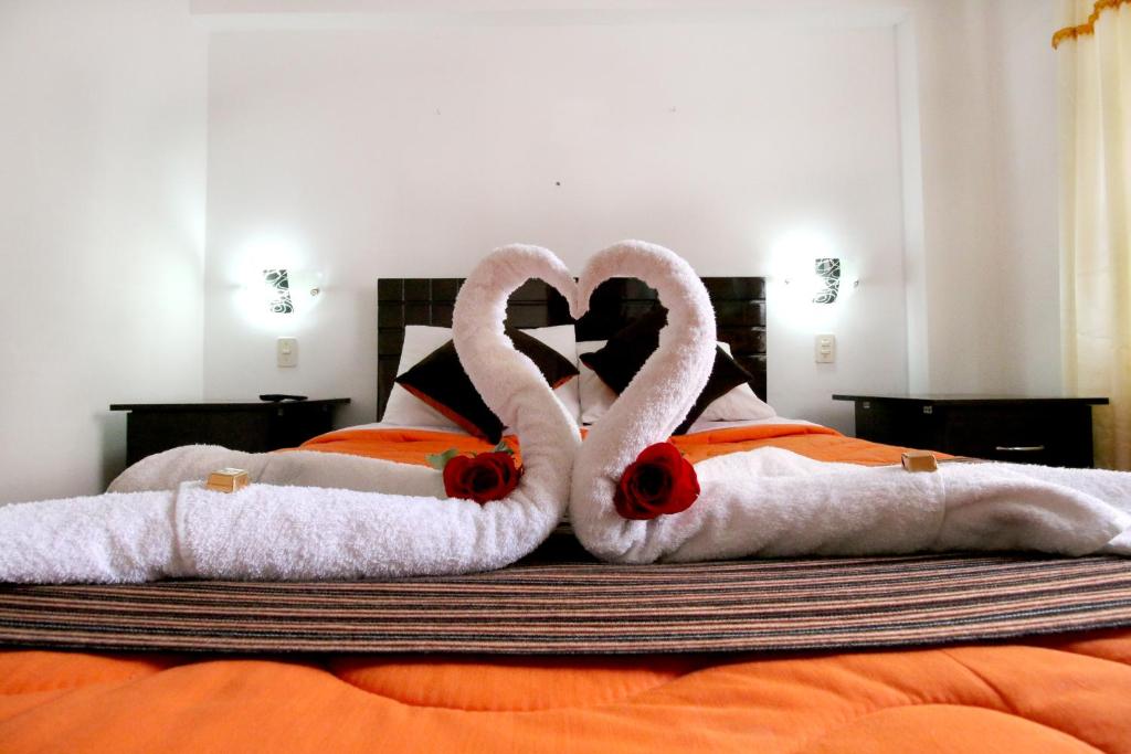Postel nebo postele na pokoji v ubytování Hotel Peru Real