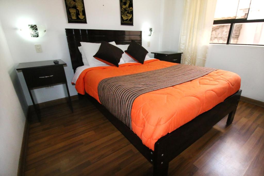Postel nebo postele na pokoji v ubytování Hotel Peru Real