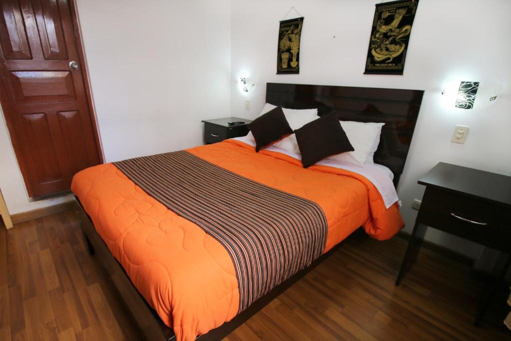 Postel nebo postele na pokoji v ubytování Hotel Peru Real