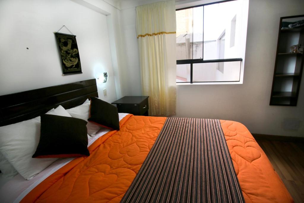 Postel nebo postele na pokoji v ubytování Hotel Peru Real