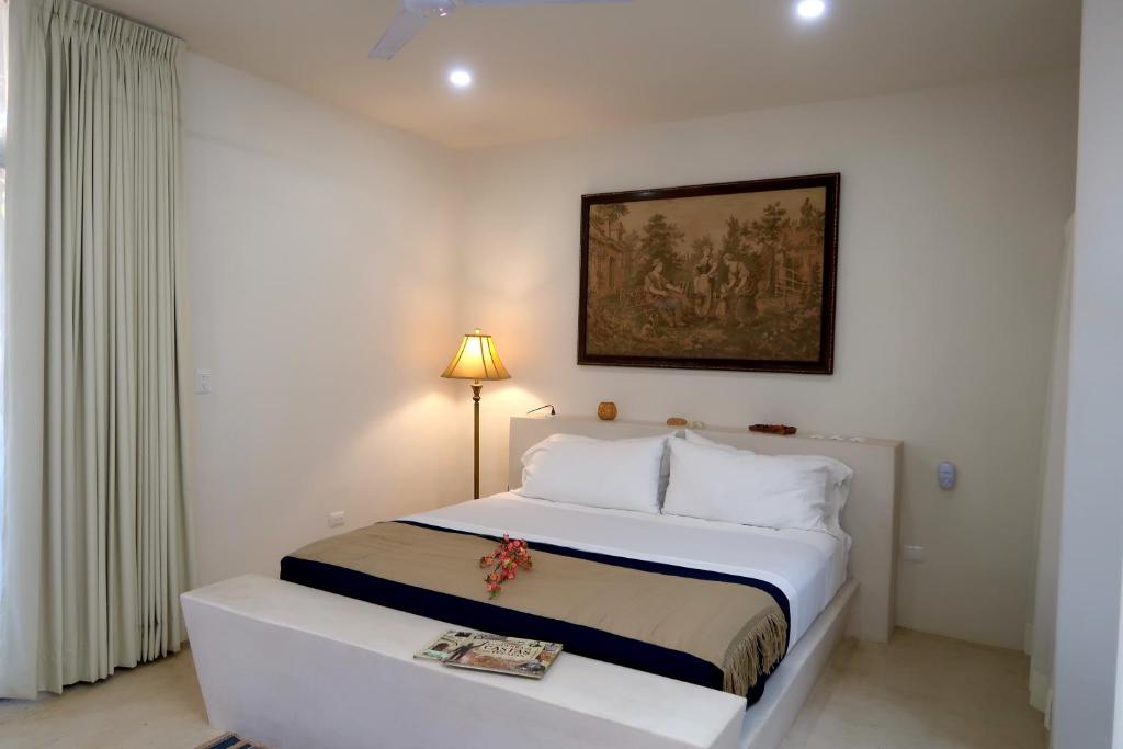 Postel nebo postele na pokoji v ubytování Hotel Casa de Campo Conkal Merida