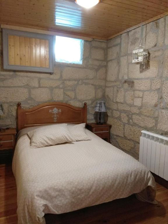 Postel nebo postele na pokoji v ubytování La Torre Mondariz