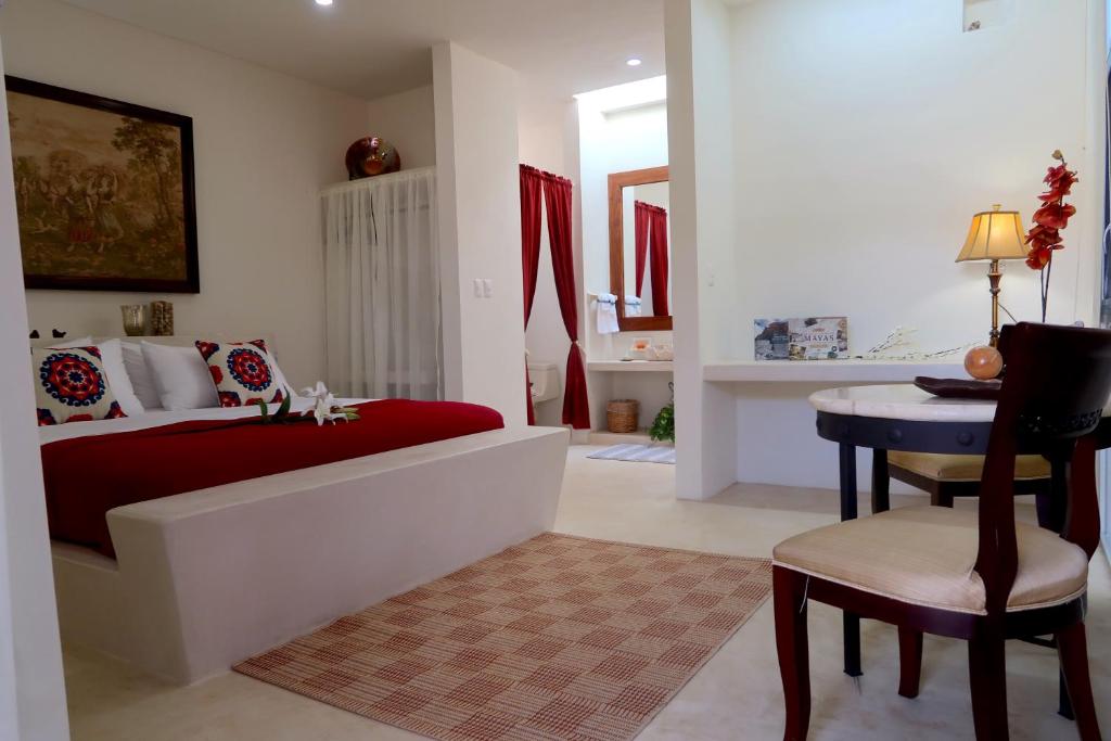 Postel nebo postele na pokoji v ubytování Hotel Casa de Campo Conkal Merida