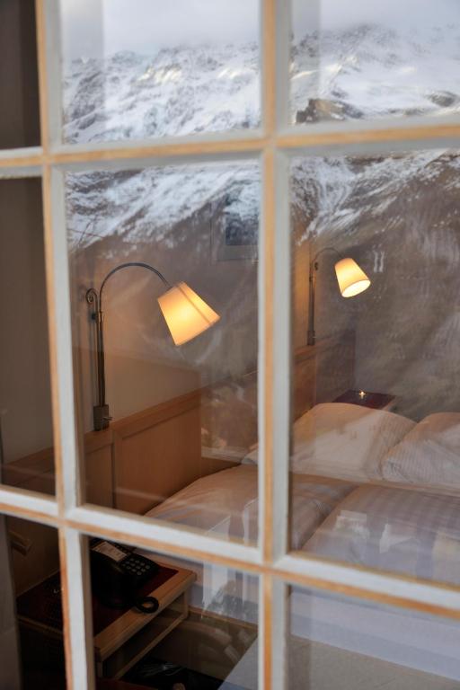 Postel nebo postele na pokoji v ubytování Hotel Alpenruh
