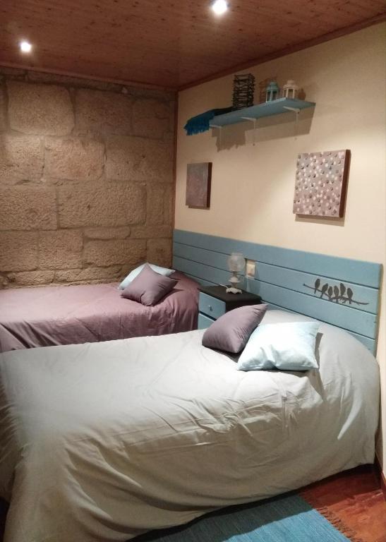 Postel nebo postele na pokoji v ubytování La Torre Mondariz