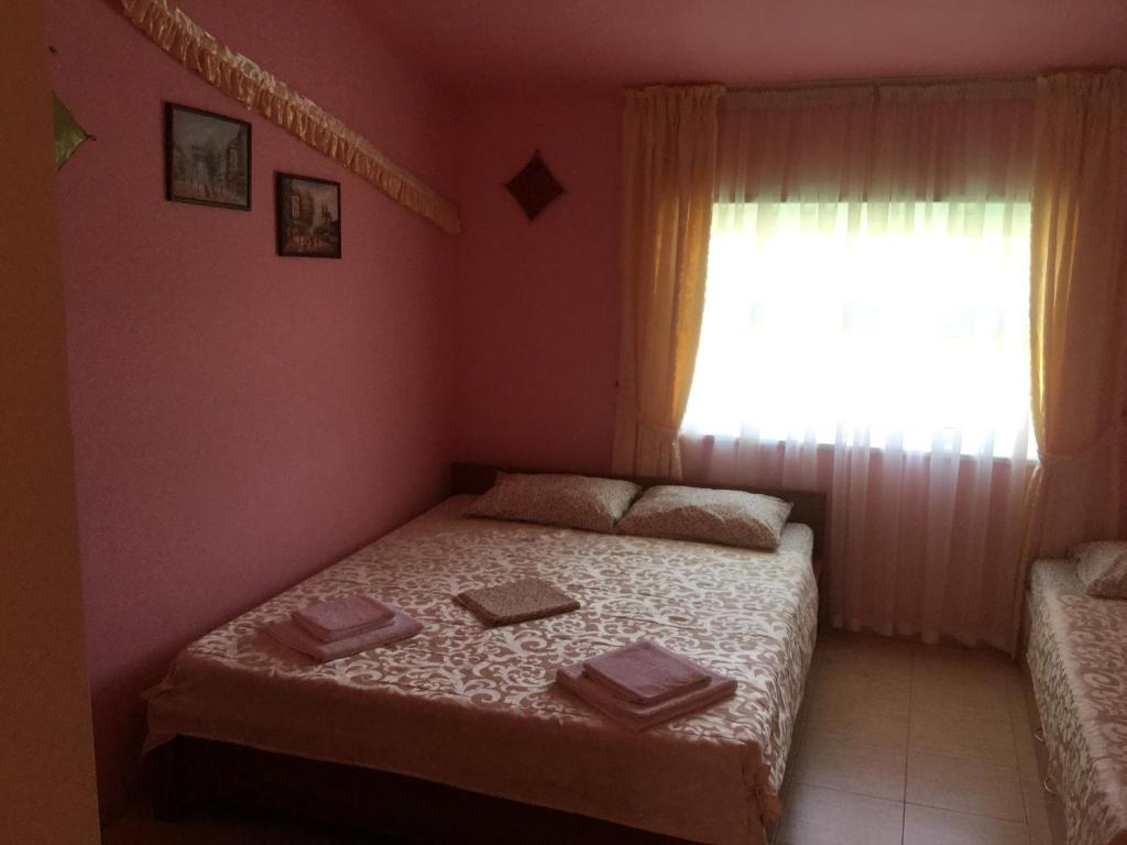 Postel nebo postele na pokoji v ubytování Aura