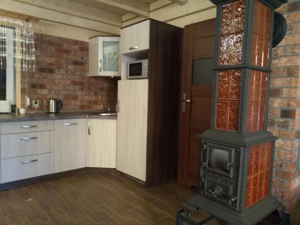 Kuchnia lub aneks kuchenny w obiekcie Bacówki nad jeziorem Goszcza