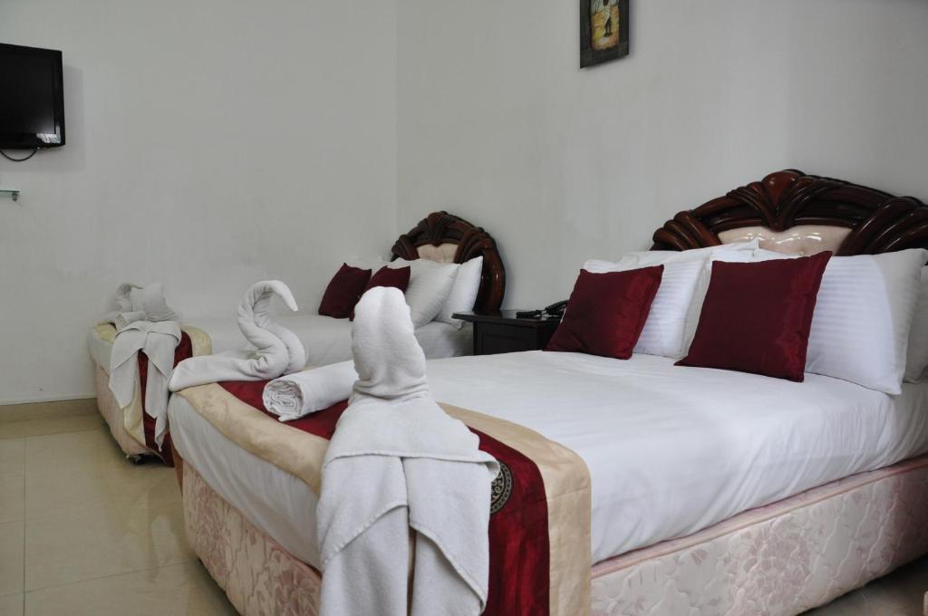 Postel nebo postele na pokoji v ubytování Villa Hotel