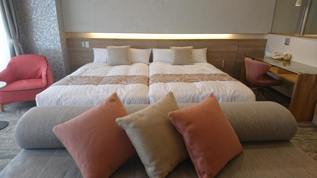 Postel nebo postele na pokoji v ubytování Hotel Spax Kusatsu