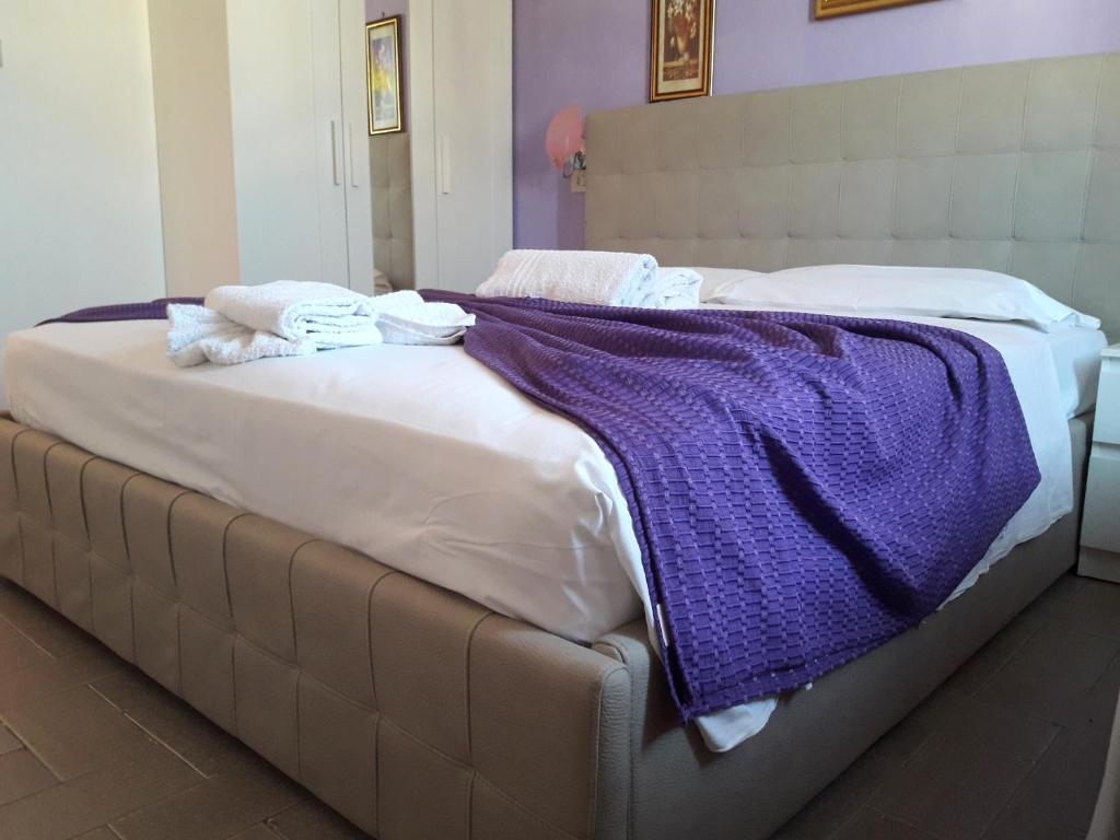 A bed or beds in a room at Hotel Fiammetta