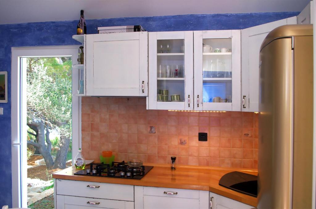Kuchyň nebo kuchyňský kout v ubytování Beach house Adriana