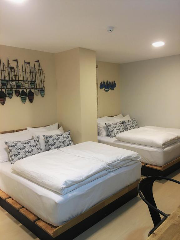 Postel nebo postele na pokoji v ubytování Bangkok Saran Poshtel
