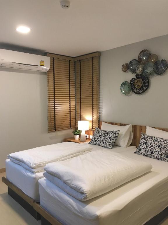 Postel nebo postele na pokoji v ubytování Bangkok Saran Poshtel