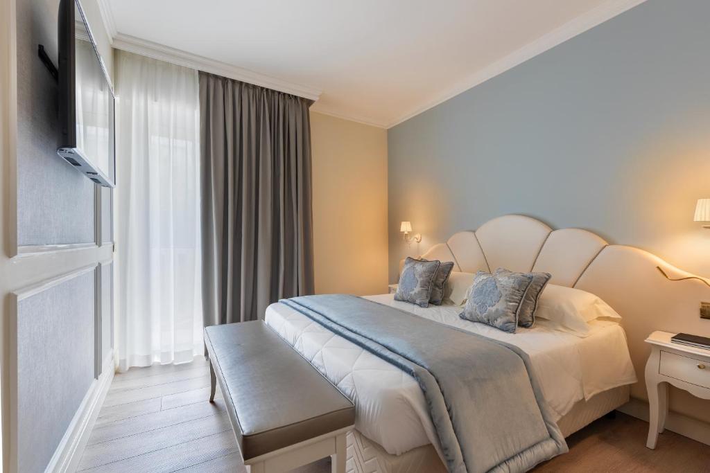 Кровать или кровати в номере Hotel Ca' D'Oro Tre Stelle Superior Adults only
