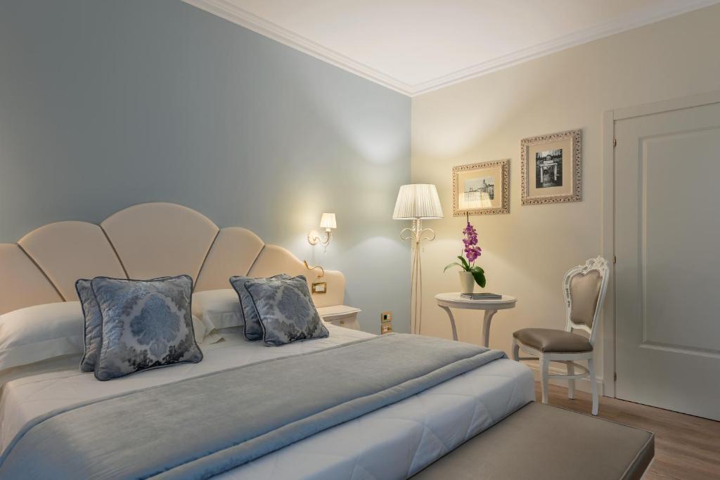 Кровать или кровати в номере Hotel Ca' D'Oro Tre Stelle Superior Adults only