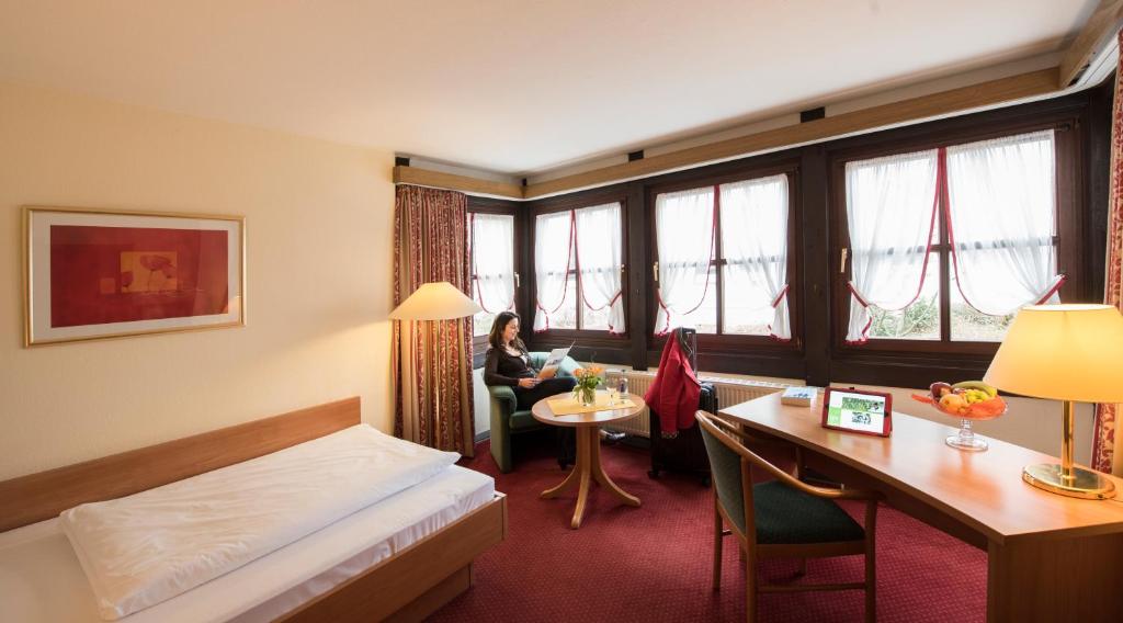 Postel nebo postele na pokoji v ubytování Hotel-Residenz Immenhof