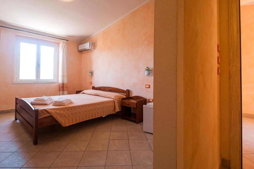 Postel nebo postele na pokoji v ubytování Melalidone
