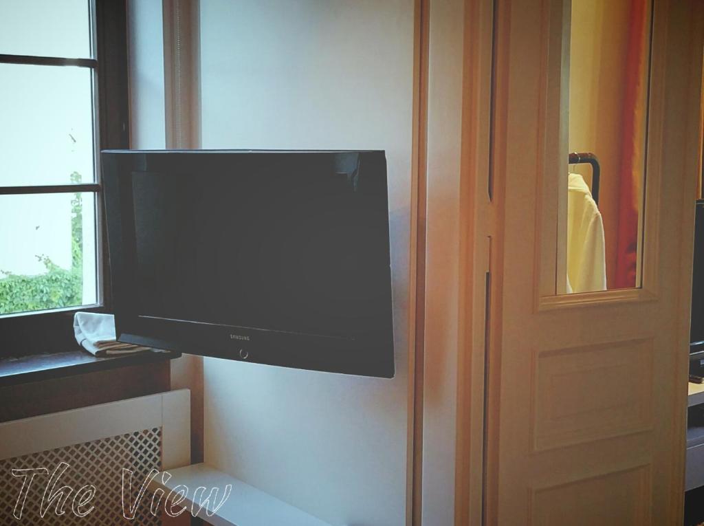 Televízia a/alebo spoločenská miestnosť v ubytovaní The View Torun