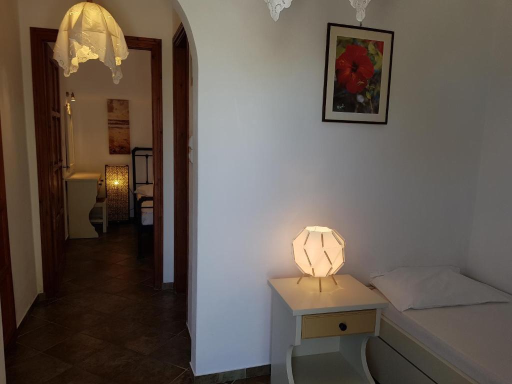 Postel nebo postele na pokoji v ubytování Ragoussis House