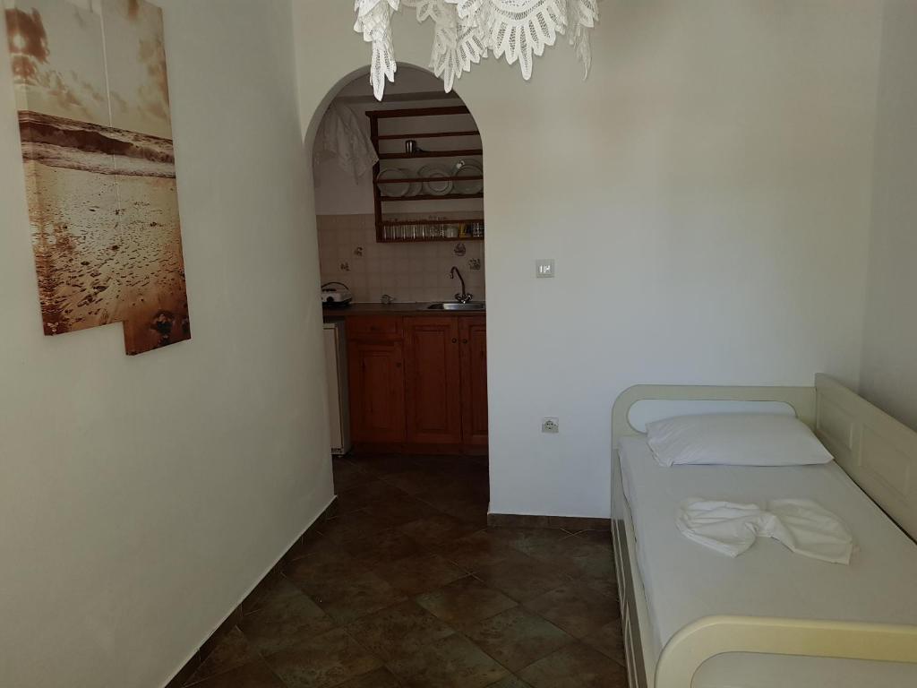 Postel nebo postele na pokoji v ubytování Ragoussis House