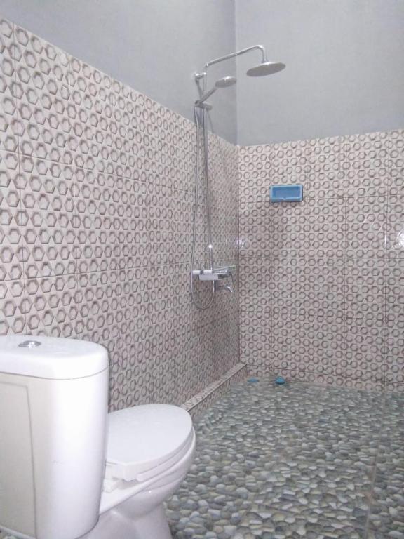 Koupelna v ubytování Sawe Homestay