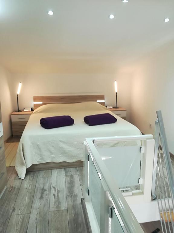 Postel nebo postele na pokoji v ubytování Apartments Vrime