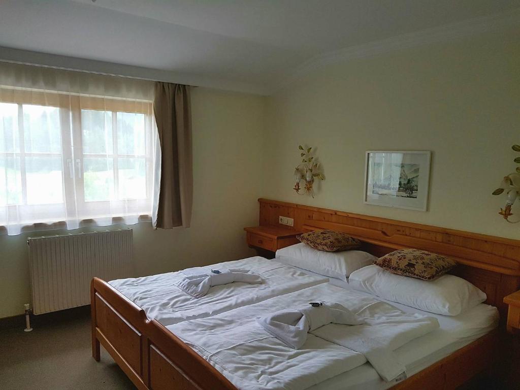 Postel nebo postele na pokoji v ubytování Hotel Tauplitzerhof