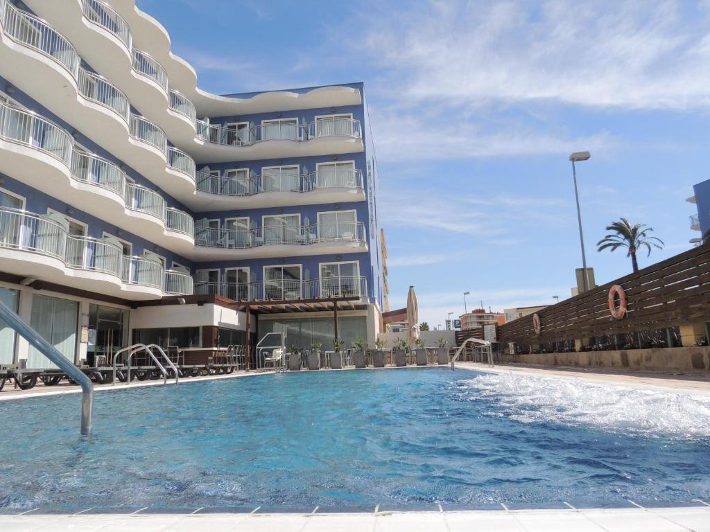 a large swimming pool in front of a hotel at Cesar Augustus in Cambrils