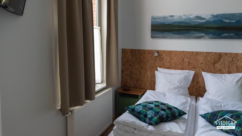 Postel nebo postele na pokoji v ubytování B&B Stoega