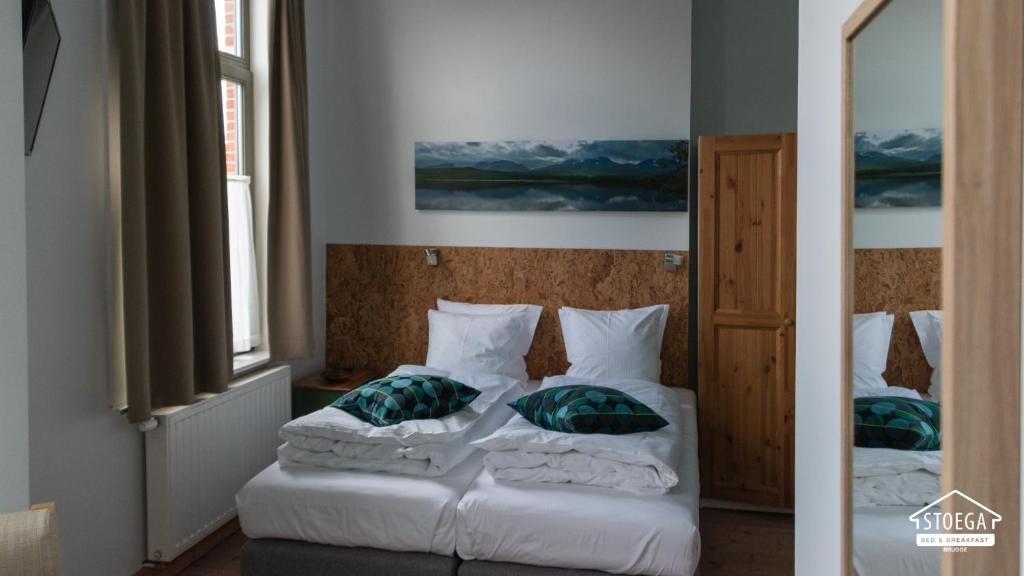 Postel nebo postele na pokoji v ubytování B&B Stoega