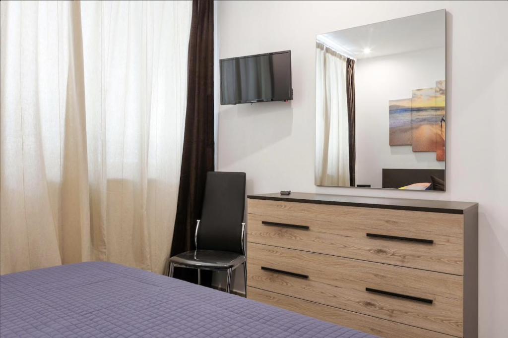 Telewizja i/lub zestaw kina domowego w obiekcie Beach Home
