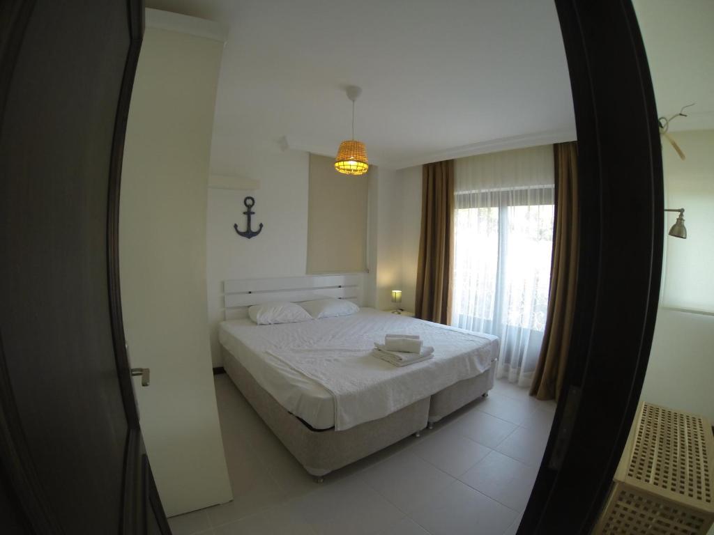 Postel nebo postele na pokoji v ubytování Derya Beach Apartment