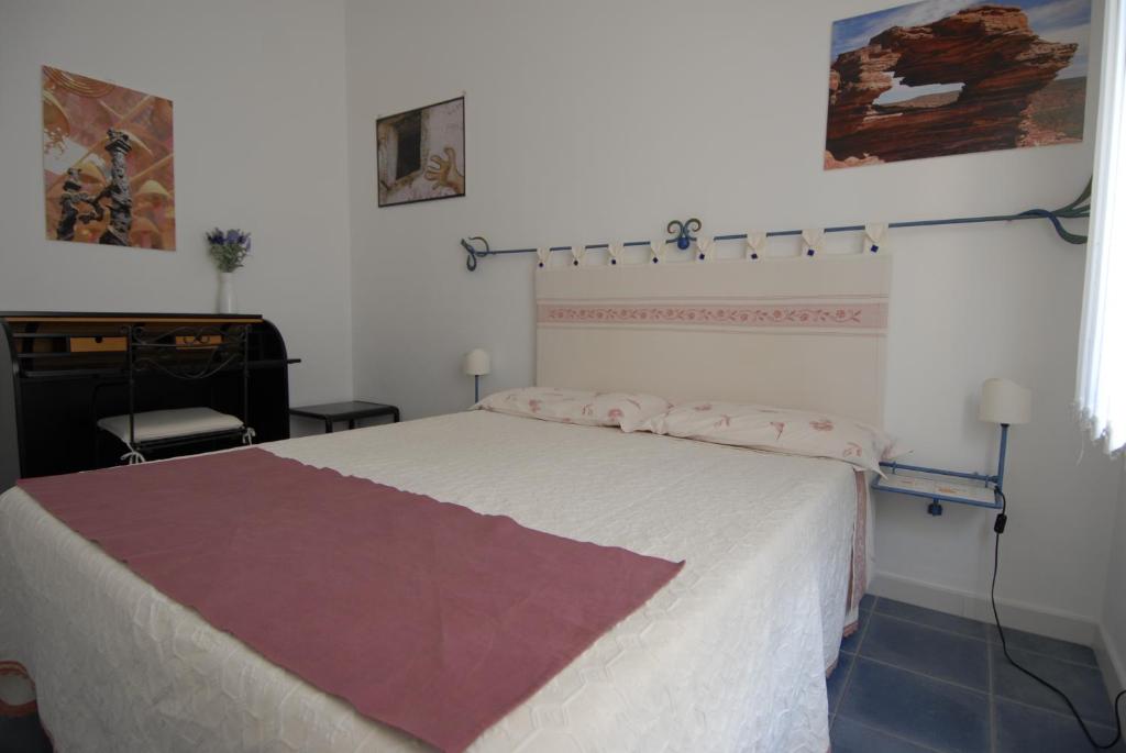 Postel nebo postele na pokoji v ubytování Nughe 'e' Oro Guesthouse