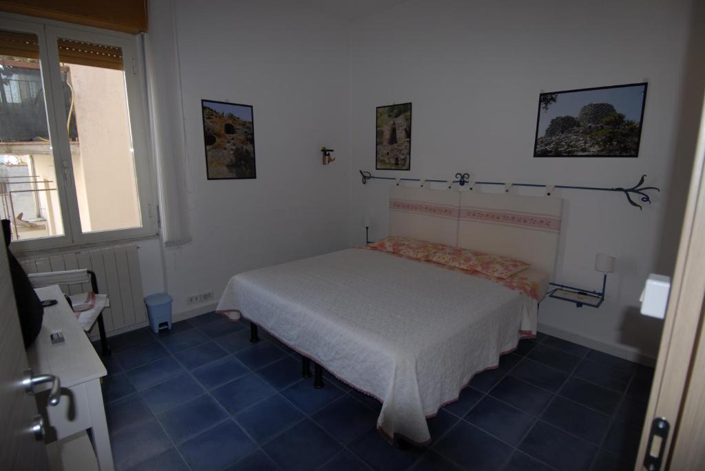 Postel nebo postele na pokoji v ubytování Nughe 'e' Oro Guesthouse