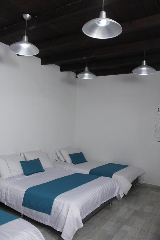 Postel nebo postele na pokoji v ubytování Almaviva Casa Hotel