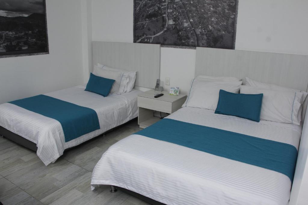 Postel nebo postele na pokoji v ubytování Almaviva Casa Hotel
