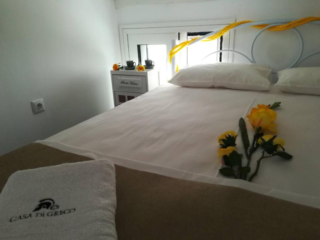 Posteľ alebo postele v izbe v ubytovaní Casa di Greco