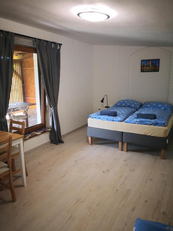 Postel nebo postele na pokoji v ubytování Apartmán Lípa Mikulov