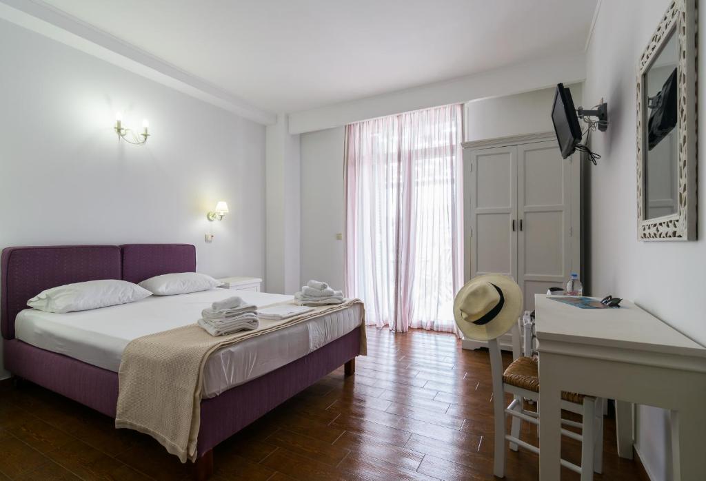 Postel nebo postele na pokoji v ubytování Malion Rooms