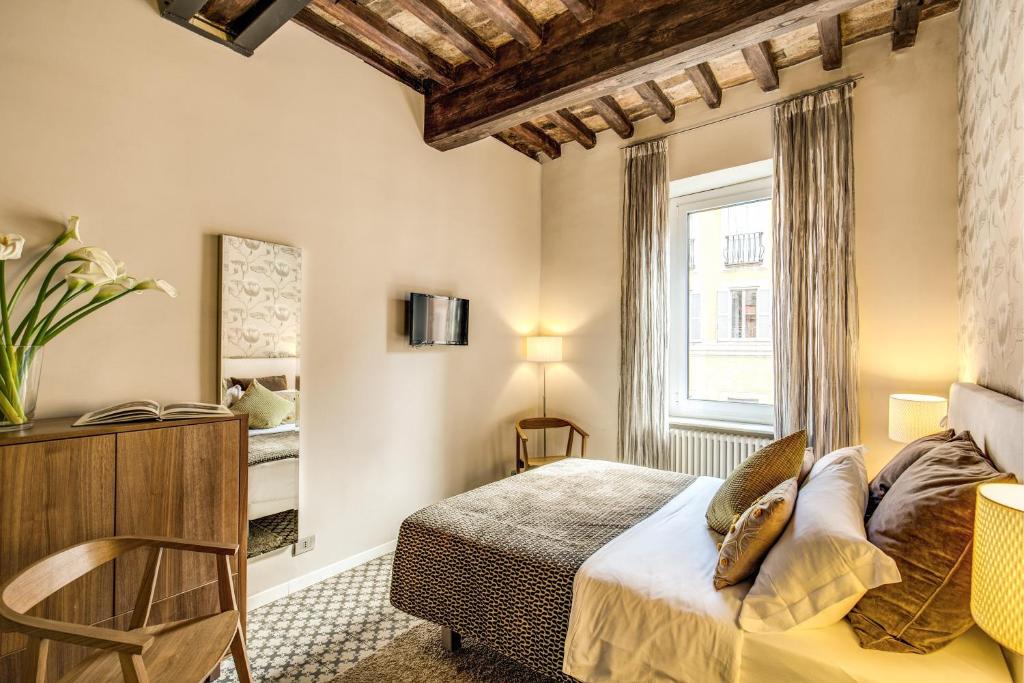 Postel nebo postele na pokoji v ubytování Trevi Beau Boutique Hotel