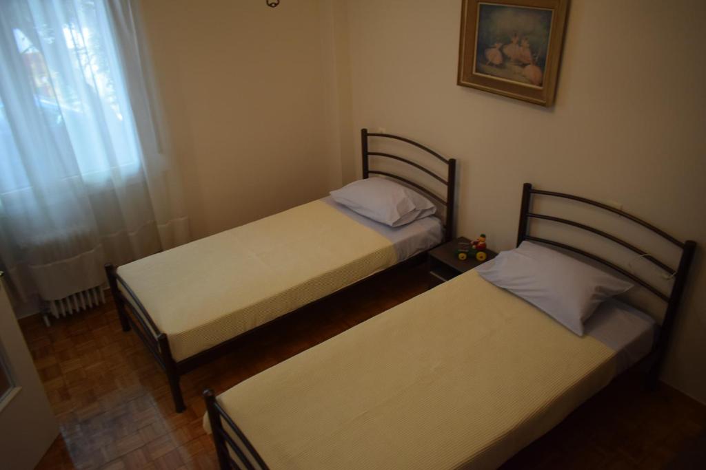 Postel nebo postele na pokoji v ubytování George apartment