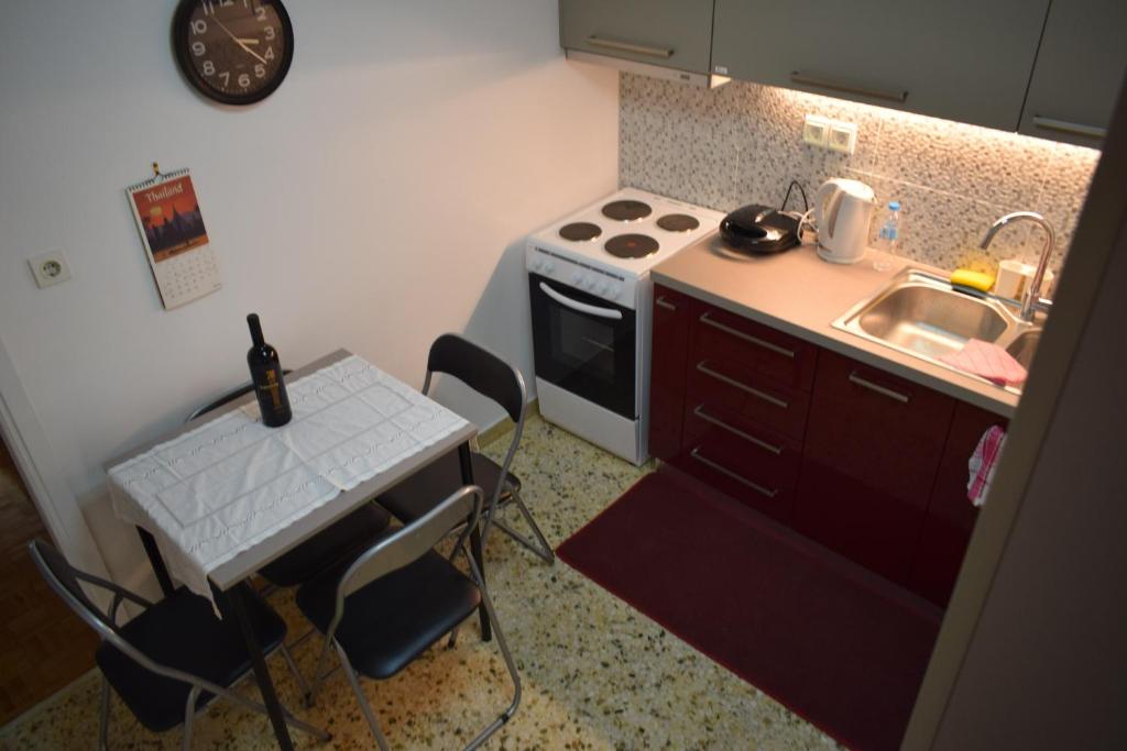 Kuchyň nebo kuchyňský kout v ubytování George apartment