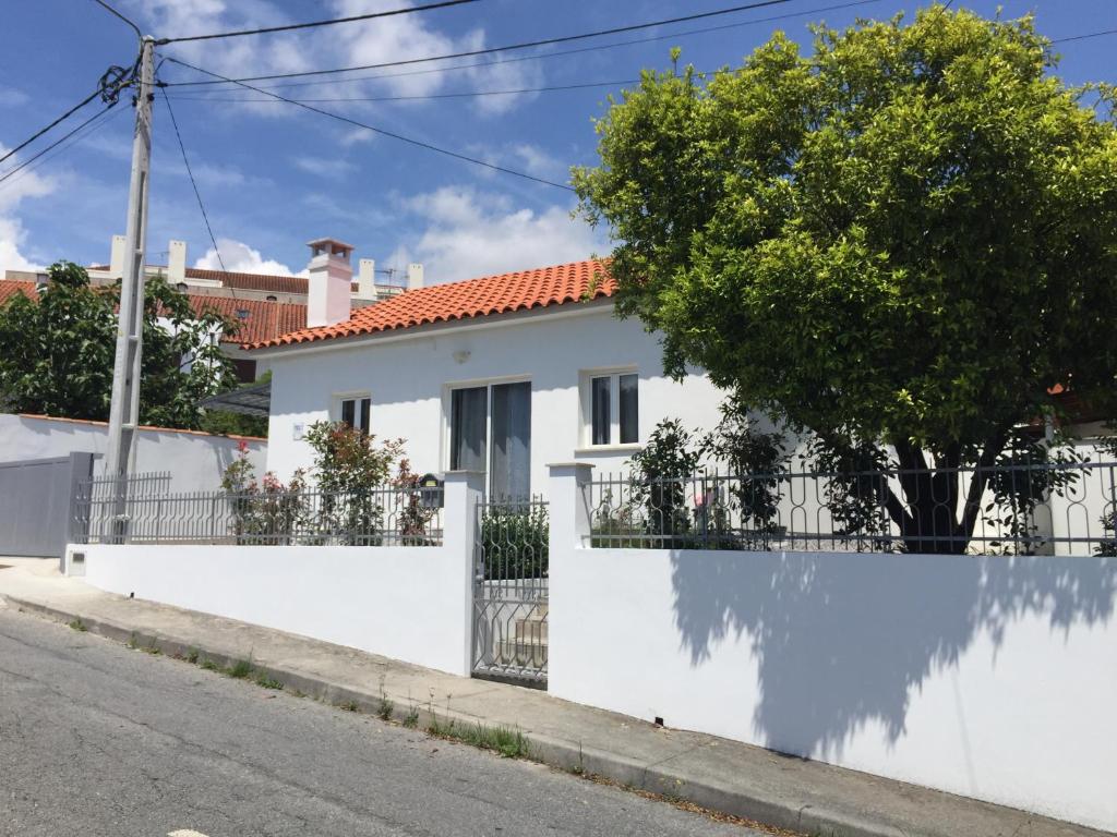 a white house on the side of a street at Casinha da Vila in Arcos de Valdevez