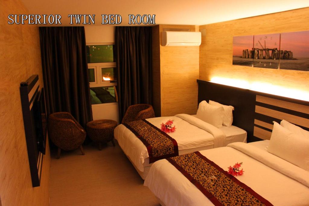 Postel nebo postele na pokoji v ubytování Hotel Time Boutique Nilai