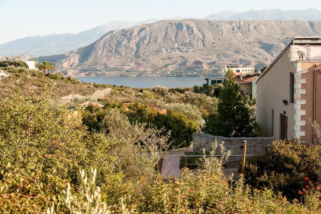 a view of a mountain and a body of water at Ktima Nikolaos in Arónion