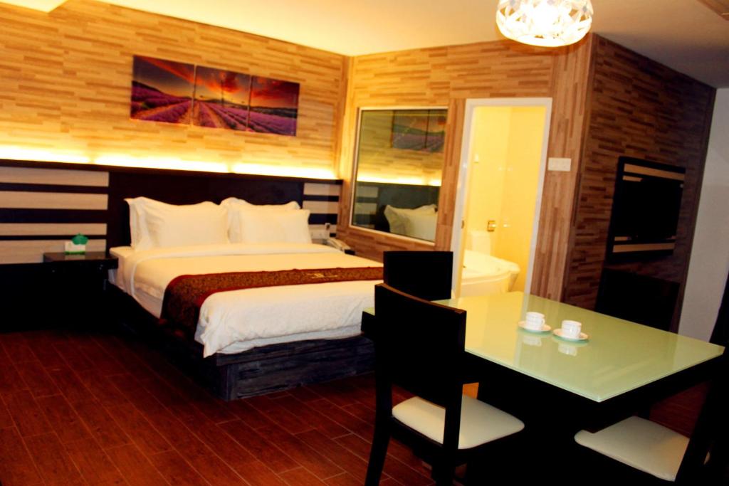 Postel nebo postele na pokoji v ubytování Hotel Time Boutique Nilai