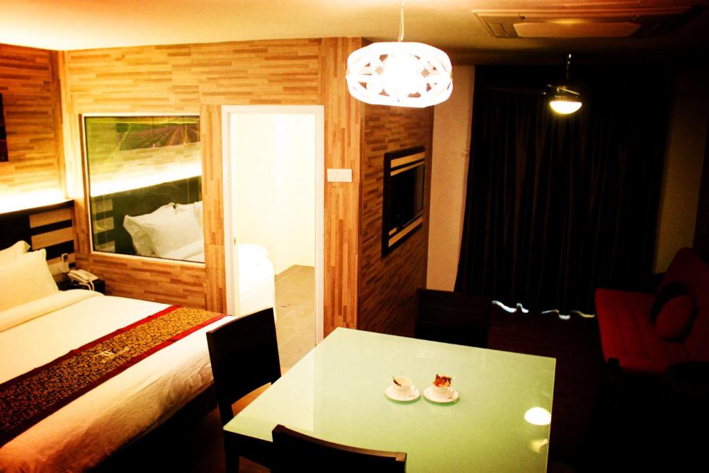 Postel nebo postele na pokoji v ubytování Hotel Time Boutique Nilai